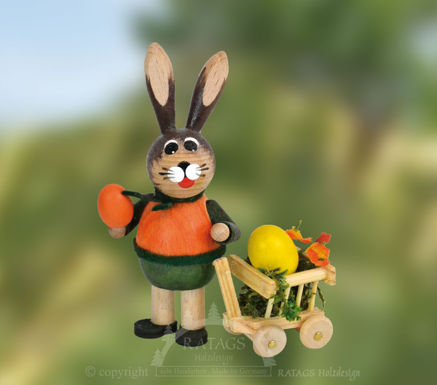 Osterhase, grün/orange, mit Handwagen Osterhase, grün/orange, mit Handwagen