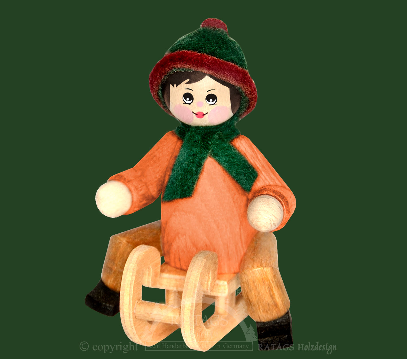 Figur, Schlittenfahrer sitzend, orange, grün-rot Figur, Schlittenfahrer sitzend, orange, grün-rot