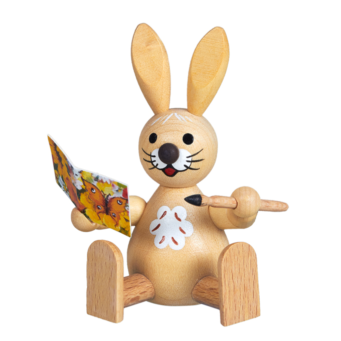 Osterhase mit Glückwunschkarte sitzend