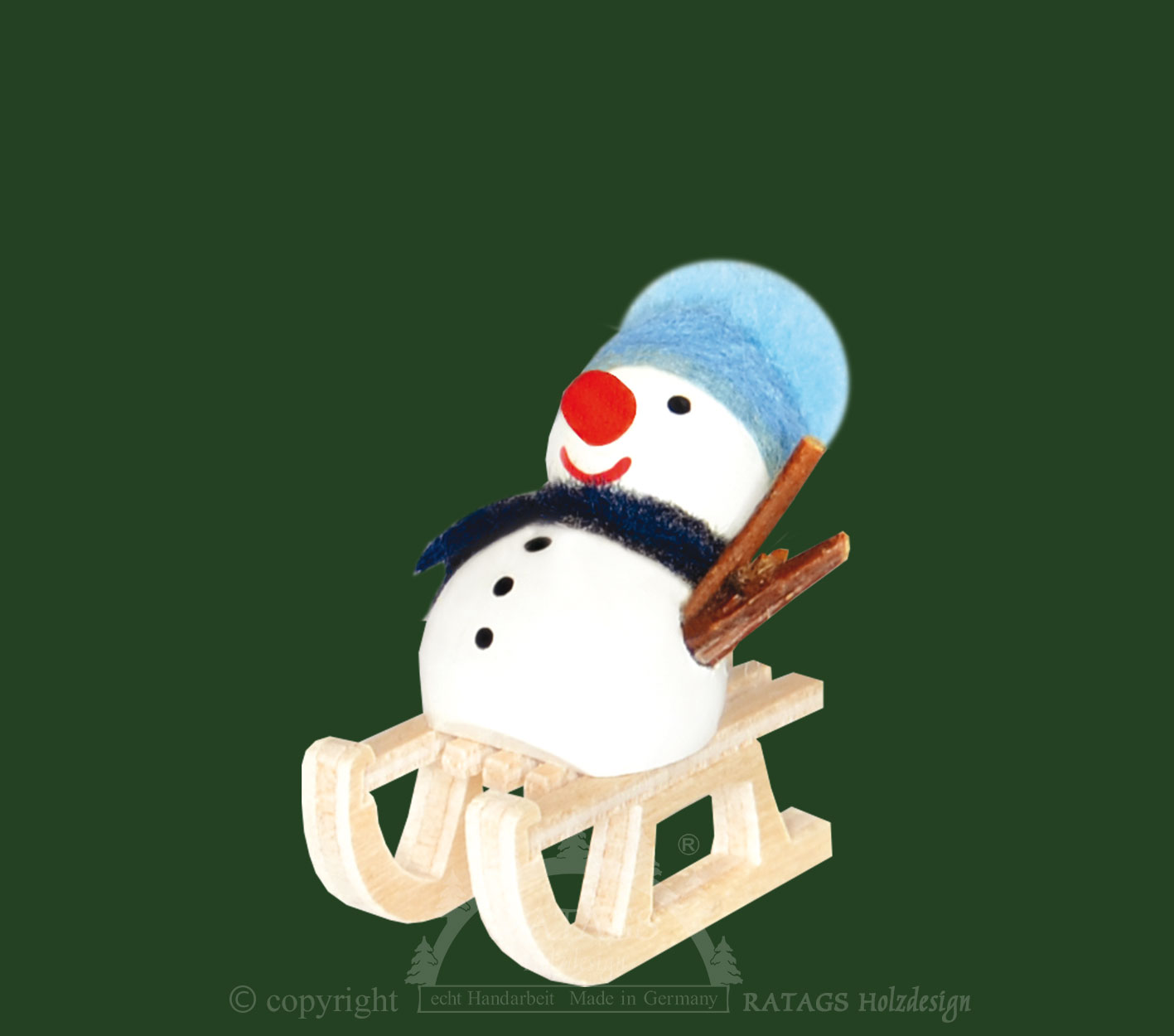 Schneemann auf Schlitten, blaue Mütze Schneemann auf Schlitten, blaue Mütze