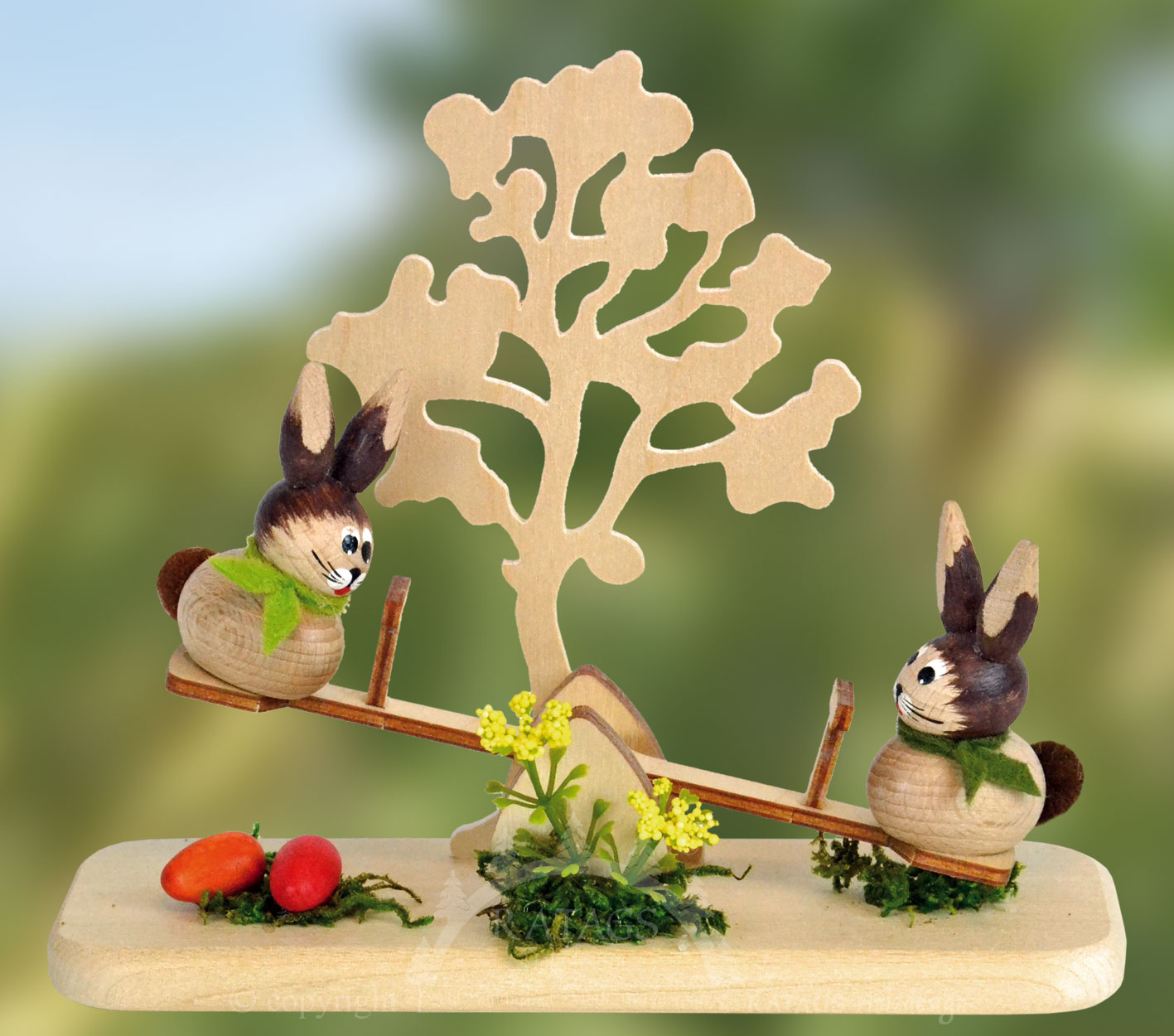 Hasenspielplatz mit Baum und Wippe Hasenspielplatz mit Baum und Wippe