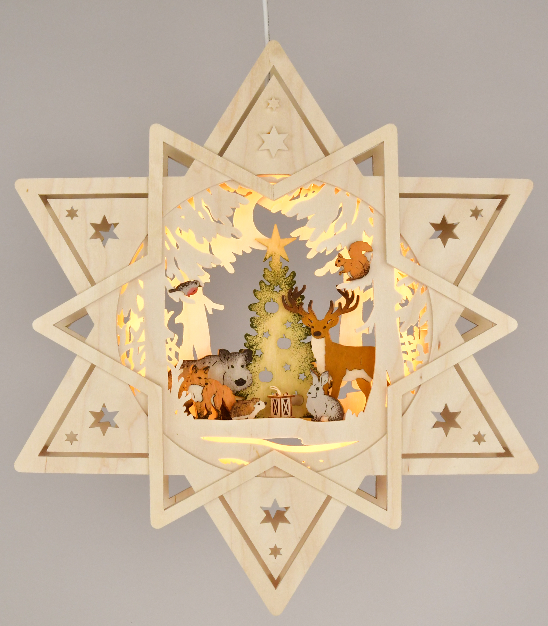 Fensterbild beleuchtet, Stern mit gesägten Waldtieren, coloriert Fensterbild beleuchtet, Stern mit gesägten Waldtieren, coloriert