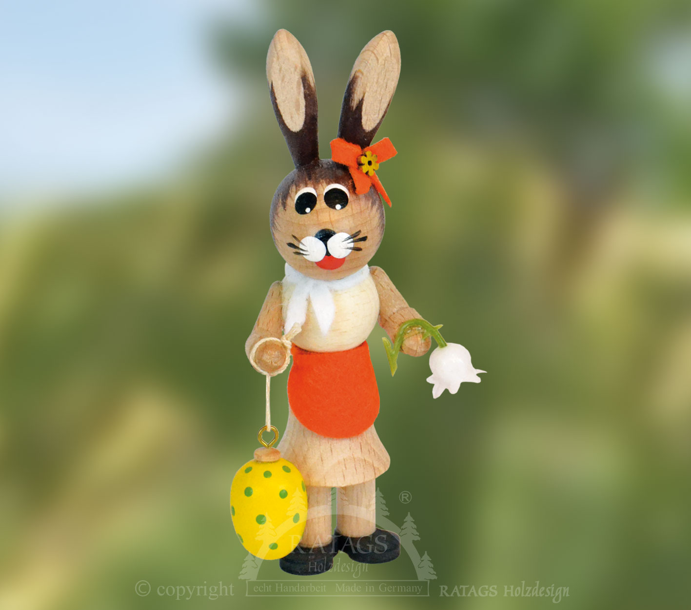Osterhäsin, orange, mit Blume und Ostere Osterhäsin, orange, mit Blume und Ostere